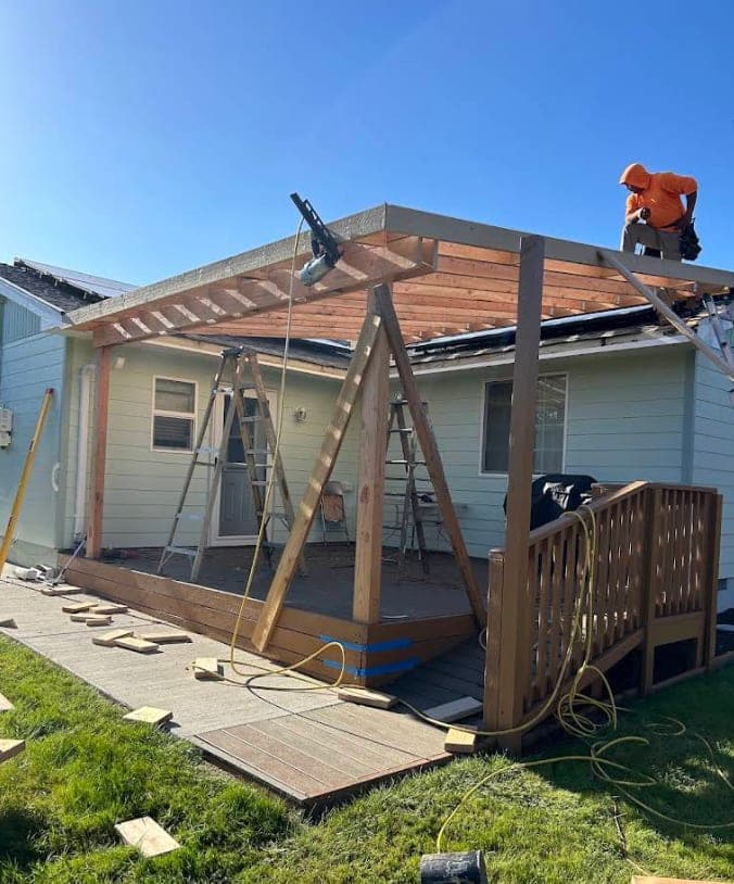 A Z&D Builders crew member framing a custom patio cover